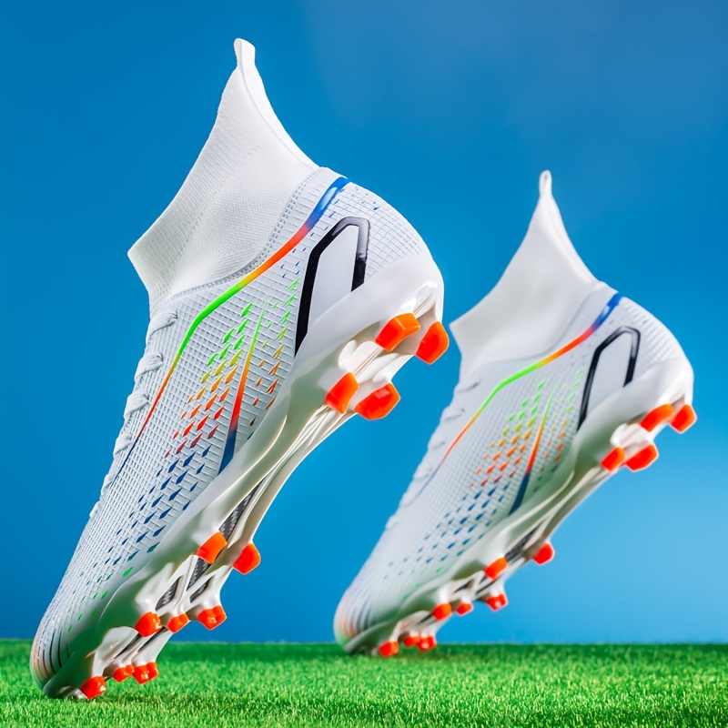Youth football boots with long studs